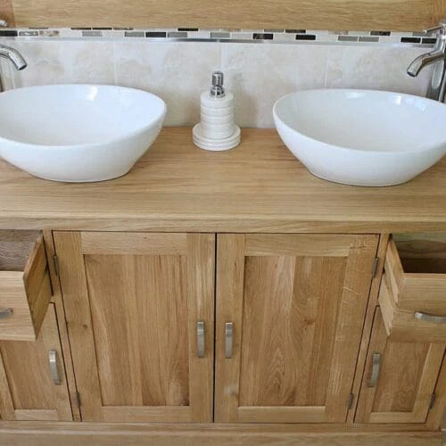 White Oval Ceramic Basins on Oak Topped Bathroom Vanity Unit Showing Opened Drawers
