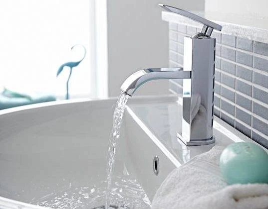 The drains once again blockage free, and water flows seamlessly from the opened tap Drain Unblocked and Water Flows out Tap