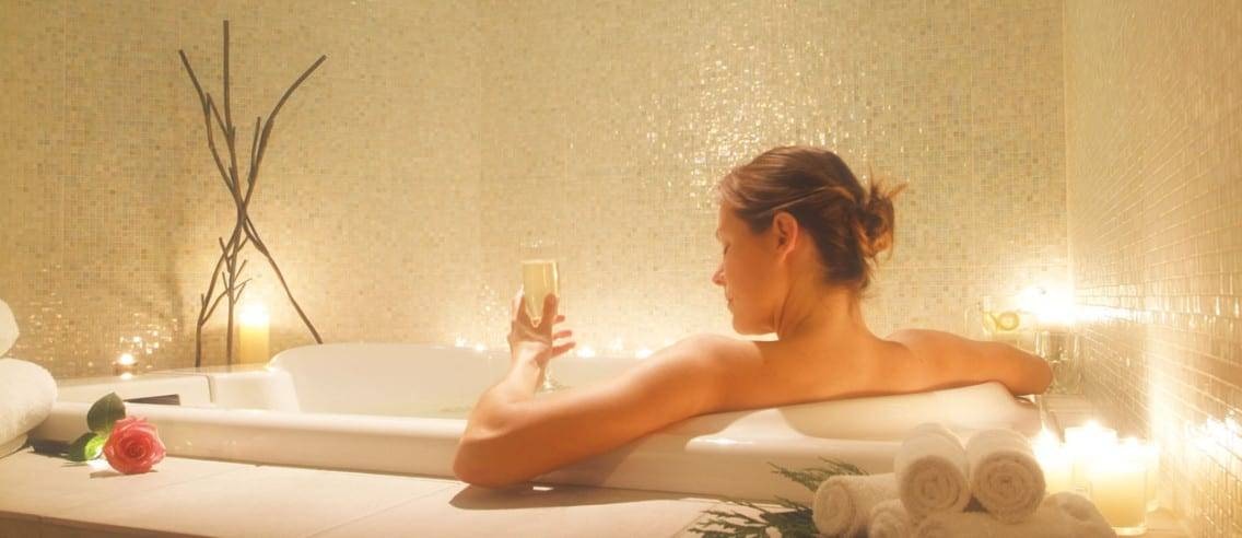 Relaxing Home Bath Spa With a Glass of Bubbly Enjoying a Glass of Champagne in the Bath