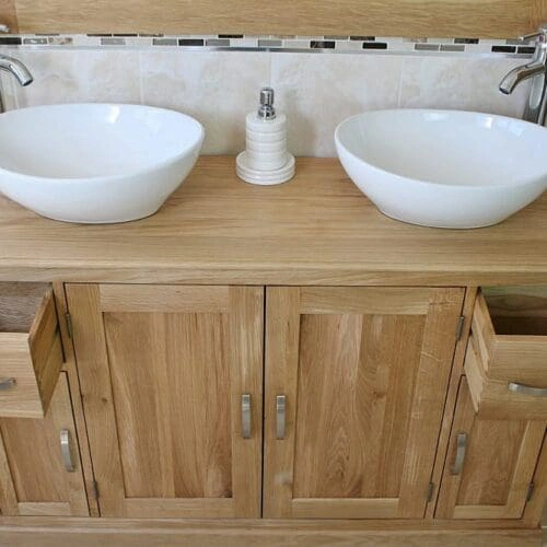White Oval Ceramic Basins on Oak Topped Bathroom Vanity Unit Showing Opened Drawers
